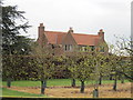 House  at  Moxby  Priory  Farm  through  Orchard