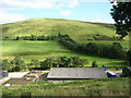 Looking over industrial buildings to the beautiful hills beyond