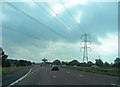 SD4952 : Powerlines cross the M6 near Forton Services by Anthony Parkes