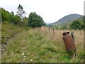 Old metal milk can on a fence, Milton of Ardtalnaig