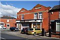 Former Co-op building on Deane Church Lane