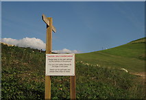 SY2590 : Notice and signpost, Axe Cliff Golf Club by Derek Harper