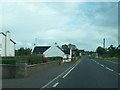 The A35 at the southern edge of the village of Kells