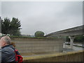 View of buildings disappearing into the clouds from Thames Barrier Park