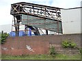 Covered conveyor belt above the canal towpath