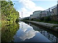 Reflections of pylon and clouds