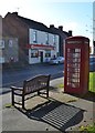 Bench, phone box and shop in Barlborough