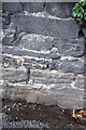 Benchmark on wall of Kirkgate