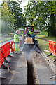 Cutting a trench in Campion Way