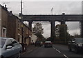 Railway viaduct and the A57 in Dinting Vale