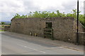 Wall (former barns) on Green Howards Road