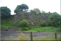 SD2385 : Disused quarry by the A595 by N Chadwick