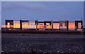 Sunset reflected in the windows by Rossall Beach