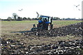 TR0524 : Ploughing near New Romney by Julian P Guffogg