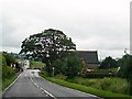 C3707 : The A5 approaching St John's (Church of Ireland) Church, Dunnalong, Bready by Eric Jones