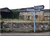 SK5190 : Signpost and old farm building in Carr by Neil Theasby