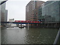 TQ3779 : View of the DLR crossing South Quay from South Quay footbridge by Robert Lamb