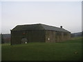 Large old barn on the golf course at Meltham