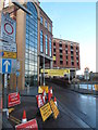 A clutter of temporary signs near the entrance to High Street Car Park, Newport