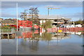 Construction work reflected in floodwater