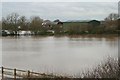 Barns and flooded fields