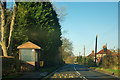 Bus stop on Main Road, B1418