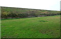 Long railway embankment near  Stanley Downton Sewage Treatment Works