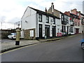 The Dock Inn, and a gold postbox