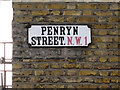 Street nameplate mounted on London brick