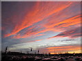 SJ3563 : A flaming sunset over Broughton Shopping Centre car park by John S Turner