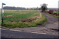 Footpath goes along the track to Grove Farm