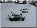 SE6183 : Snow-covered picnic tables, Helmsley Castle by David Hawgood