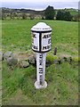 Milepost beside the A523