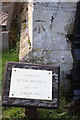 Benchmark and memorial plaque, St James the Great Church