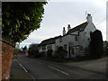 Adjoining cottages, thatched and tiled roofs