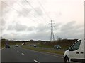 SW9460 : A30 and power lines on Goss Moor by David Smith