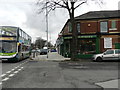 Antiques shop and 192 bus on A6, Stockport