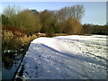 Snowy Hertfordshire Way path next to the River Beane