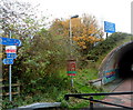 Signs at the northern edge of a tunnel under the M48 near Chepstow