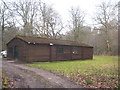 A timber shed in a clearing in Fonthill Abbey Wood