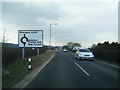 SH9977 : A547 approaching Porth Farm roundabout by Colin Pyle