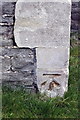 Benchmark on tower buttress of Holy Trinity Stapleton