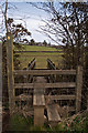 A footbridge over a stream which runs into Langham Lake