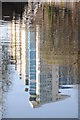 Towerblock reflected in the canal