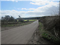 NU0930 : Looking along the country road between Belford and Chatton by Graham Robson