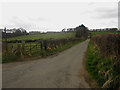NU0932 : Farm lane to Belford Mains by Graham Robson