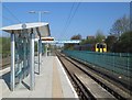 Two trains and a tram stop