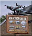 Village sign and Lancaster bomber