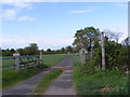 TM3786 : Footpath to Great Common Lane & entrance to Great Common Farmhouse by Geographer