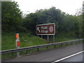 Model Village sign on M40